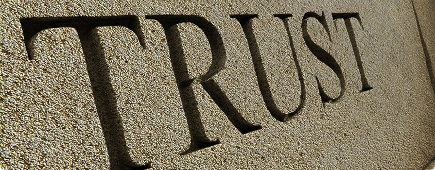 the word trust engraved in wall