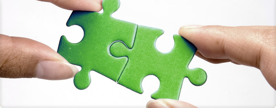 2 green jigsaw pieces merging together