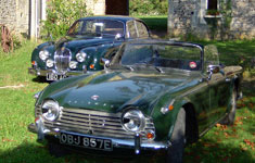 the owner's Jaguar MKII and a visiting friend's Triumph TR4A IRS